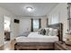 Bedroom with natural light coming through the window and an ensuite bathroom at 833 N Grand Nw Ave, Atlanta, GA 30318