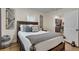 Bedroom with rustic wooden accents and hardwood flooring that flows into the kitchen at 833 N Grand Nw Ave, Atlanta, GA 30318