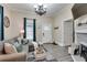 Well-lit living room with a comfortable sofa, fireplace, and neutral color palette at 833 N Grand Nw Ave, Atlanta, GA 30318
