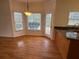 Bright breakfast nook with windows and hardwood floors, adjacent to kitchen area at 9560 Knollcrest Blvd, Alpharetta, GA 30022