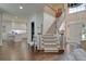 Welcoming foyer features a beautiful staircase, high ceilings and views into the modern kitchen at 155 Oakpark Ct, Mcdonough, GA 30253