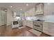 Well-equipped kitchen features stainless steel appliances, custom cabinetry and ample counter space at 155 Oakpark Ct, Mcdonough, GA 30253