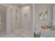 Modern shower features white marble, patterned floor, and glass enclosure at 155 Oakpark Ct, Mcdonough, GA 30253