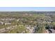 An aerial view of a wooded neighborhood featuring multi-Gathering housing and a distant mountain at 2201 Fairington Village Dr, Lithonia, GA 30038
