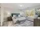 Inviting bedroom with large windows providing natural light, stylish furniture, and serene decor at 2201 Fairington Village Dr, Lithonia, GA 30038