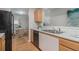 Spacious kitchen next to dining room with granite counters, ample cabinet space, and modern appliances at 2201 Fairington Village Dr, Lithonia, GA 30038
