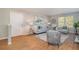 Comfortable living room boasts hardwood floors, natural light, stylish furniture and modern decor at 2201 Fairington Village Dr, Lithonia, GA 30038