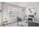 Neutral office space with a desk, chairs, and a large window with lots of natural light at 2201 Fairington Village Dr, Lithonia, GA 30038