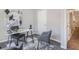 This is an office with a modern desk and chairs, a large window, light walls and gray carpet at 2201 Fairington Village Dr, Lithonia, GA 30038