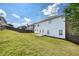 Extensive backyard with a lush lawn and privacy fence, offering a serene outdoor space for relaxation and recreation at 3772 Sunbridge Dr, Snellville, GA 30039