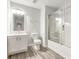 Bathroom with a vanity, toilet, tub, and sliding glass door at 3772 Sunbridge Dr, Snellville, GA 30039