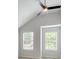 Vaulted bedroom with two windows, ceiling fan, and neutral carpet at 3772 Sunbridge Dr, Snellville, GA 30039