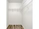 A small closet with wire shelving and wood-look floors at 3772 Sunbridge Dr, Snellville, GA 30039