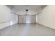 Clean and spacious garage with an automatic door and epoxy flooring is ready for your vehicles and storage at 3772 Sunbridge Dr, Snellville, GA 30039