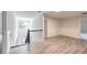 Upstairs hallway area with decorative trim, plank flooring and modern chandelier at 3772 Sunbridge Dr, Snellville, GA 30039