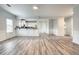 Spacious living room with luxury vinyl plank flooring, a neutral color palette, and natural light at 3772 Sunbridge Dr, Snellville, GA 30039