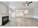 Open-concept living area features a fireplace and easy access to the kitchen at 3772 Sunbridge Dr, Snellville, GA 30039
