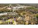 Wide aerial view of neighborhood with trees and shopping center nearby at 461 Deckner Sw Ave, Atlanta, GA 30310