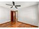 Bright bedroom featuring neutral walls, wood floors, and view of hallway at 461 Deckner Sw Ave, Atlanta, GA 30310