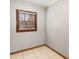 Bright sunroom featuring neutral walls, tile flooring, window with blinds, and wood trim at 461 Deckner Sw Ave, Atlanta, GA 30310