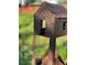 Unique rustic metal art structure of a tiny house on a post at 808 Dixie Ne Ave, Atlanta, GA 30307