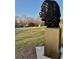 A black metal silhouette artwork on a metal pedestal with a paved path and green grass at 808 Dixie Ne Ave, Atlanta, GA 30307