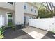 Cozy back patio featuring a white fence, landscaping, and an outdoor area for relaxing and entertaining at 808 Dixie Ne Ave, Atlanta, GA 30307