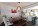 Charming dining area with wood table, comfortable seating, and a view into the modern kitchen at 808 Dixie Ne Ave, Atlanta, GA 30307