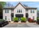 Attractive townhouse exterior with blue door awnings, manicured landscaping, and visible parking at 808 Dixie Ne Ave, Atlanta, GA 30307