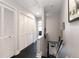 Hallway with white paneled doors, a staircase, and neutral wall paint at 808 Dixie Ne Ave, Atlanta, GA 30307