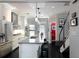 Bright kitchen featuring white cabinets, stainless steel appliances, and stylish bar stool seating at 808 Dixie Ne Ave, Atlanta, GA 30307