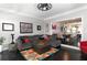 Cozy living room with a plush sofa, colorful rug, and an open view into the dining area at 808 Dixie Ne Ave, Atlanta, GA 30307