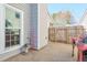 View of a concrete patio, a wooden fence, and the exterior of the home at 245 Dennis Dr, Alpharetta, GA 30009