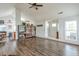 Bright living room featuring dark hardwood floors, an open floor plan and a white door at 245 Dennis Dr, Alpharetta, GA 30009