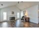 Bright living room featuring a white fireplace, hardwood floors and vaulted ceiling at 245 Dennis Dr, Alpharetta, GA 30009