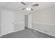 Well-lit bedroom featuring two-tone paint, ceiling fan, and carpeting at 50 Riverside Ct, Hampton, GA 30228