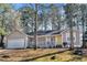 Charming single-story home with a welcoming front porch and attached two-car garage at 50 Riverside Ct, Hampton, GA 30228