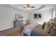 Large, bright bedroom with ceiling fan, soft rug, and neutral colors at 50 Riverside Ct, Hampton, GA 30228