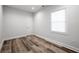 Simple bedroom with wood floors, natural light, and a neutral color scheme at 872 Beryl Sw St, Atlanta, GA 30310