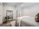 Bright bedroom with a full length mirror and a patterned gray coverlet on the bed at 872 Beryl Sw St, Atlanta, GA 30310