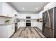 Modern kitchen with stainless steel appliances, white cabinets and granite countertops at 872 Beryl Sw St, Atlanta, GA 30310