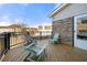 Relaxing deck area with wooden flooring, black railing, and comfortable outdoor seating with a serene view at 1191 Fountain Head Ct, Lawrenceville, GA 30043