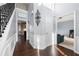 Elegant foyer with hardwood floors, wainscoting, and a staircase with iron balusters at 1191 Fountain Head Ct, Lawrenceville, GA 30043