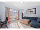 Bright living room with plush seating, soft carpeting, and natural light at 1191 Fountain Head Ct, Lawrenceville, GA 30043