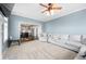 Spacious living room connected to the kitchen, featuring a comfortable sofa and neutral tones at 1191 Fountain Head Ct, Lawrenceville, GA 30043