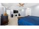 Large main bedroom featuring a tray ceiling, carpet, a fireplace, and a TV at 1191 Fountain Head Ct, Lawrenceville, GA 30043