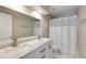 Clean bathroom featuring marble countertops, double sinks, and a shower-tub combination at 5446 Oxford Chase Way, Dunwoody, GA 30338