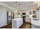 Charming kitchen featuring white cabinets, stainless steel appliances, and a central island at 5446 Oxford Chase Way, Dunwoody, GA 30338