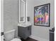 Stylish powder room with modern fixtures, a floating vanity, and artistic wall decor for a sophisticated touch at 574 Boulevard Ne Pl # 5, Atlanta, GA 30308