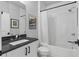 This bathroom has a shower with a curtain, a vanity with a mirror, and a toilet at 574 Boulevard Ne Pl # 5, Atlanta, GA 30308